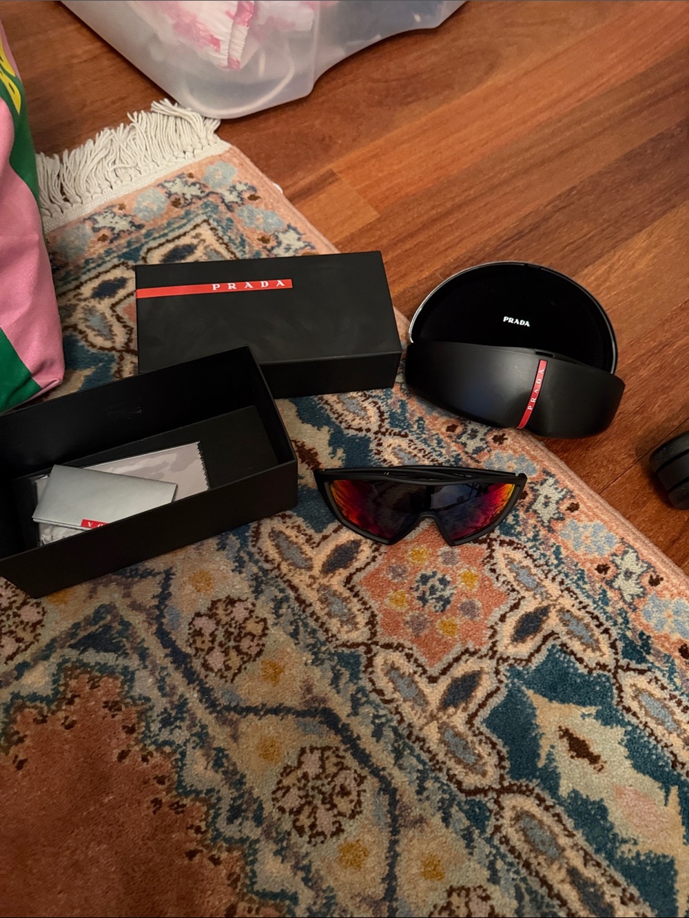 Prada Black Frame Sunglasses with Red Mirrored Lenses